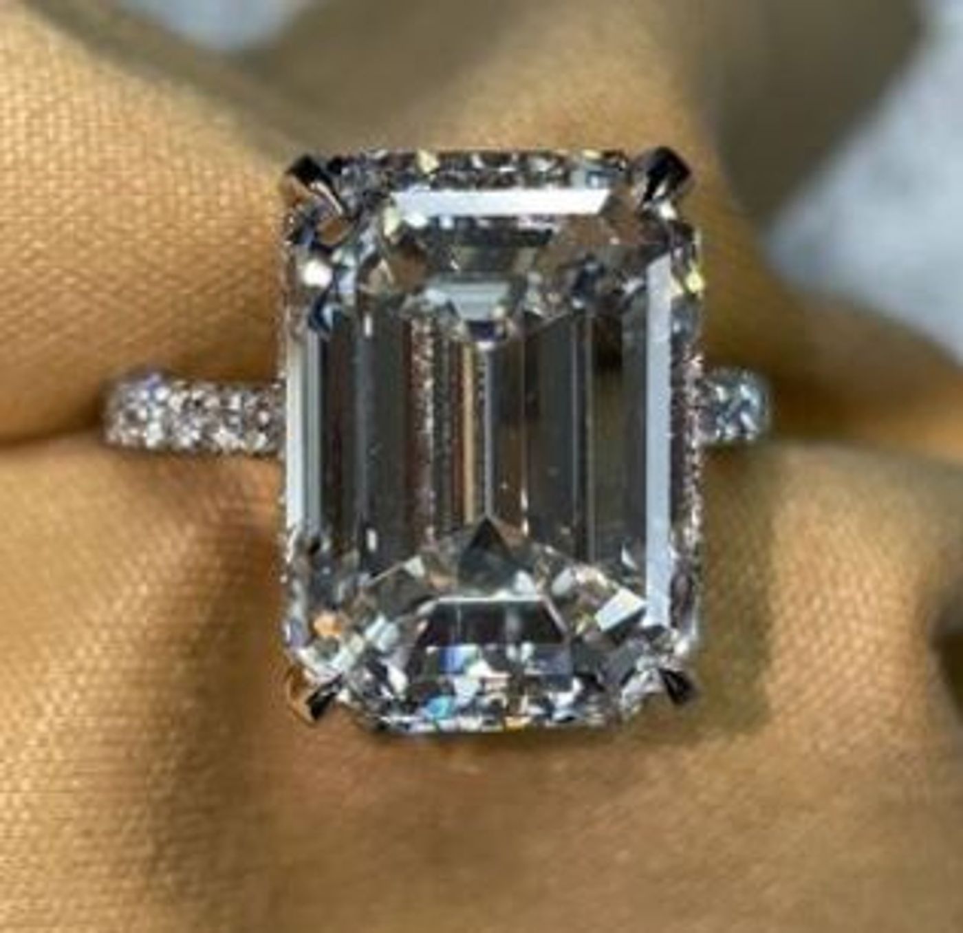 Emerald-cut diamond with pavé band